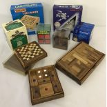 A box of wooden puzzle and conundrum games.