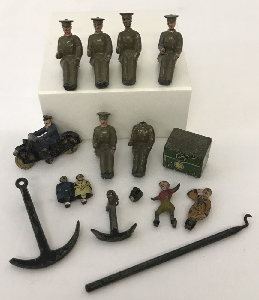 A small collection of pre war lead figures and play pieces to include Britains and Dinky.