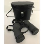 A pair of Swift binoculars 10 x 50. In leather carrying case.