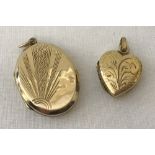 A 9ct gold front and back oval locket with sunray design to front.