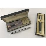 A boxed Balmain, Paris gunmetal grey ball point pen.