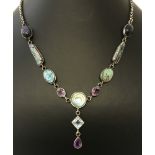 A modern design silver drop style necklace set with natural and semi precious stones.