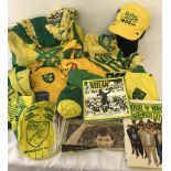 A collection of Norwich City football shirts, scarves, hats and ephemera.