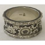 A 925 silver steampunk style band ring with cogwheel design to entire band.