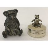 A small silver teddy bear trinket box. Bear has moveable head and arms.