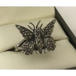 A vintage butterfly dress ring set with marcasite stones. Marked sterling inside band.