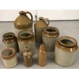 Four vintage stone bottles together with five stone jars. To include Batey and R White.