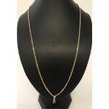 A 9ct yellow gold 26" curb chain with a 9ct gold lobster clasp pendant.