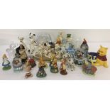 A collection of Disney character figures and snow globes.