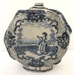 A vintage continental terracotta circular water bottle with blue and white painted classical scene.
