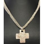 A contemporary design silver cross on a multi strand Singapore chain.