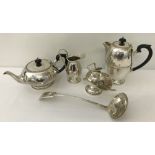 A vintage 4 piece silver plated tea set together with a ladle and a jam spoon.