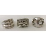 Three modern silver dress rings. To include one with elephant decoration.