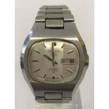 A men's Seiko 5 automatic wristwatch with silver tone stainless steel strap.