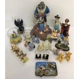 A box of Disney character figures and snow globes.