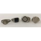 Four men's silver and white metal signet and dress rings.