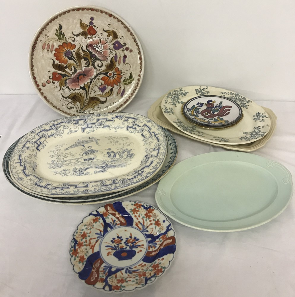 A collection of decorative plates and meat platters to include English & Continental makers.