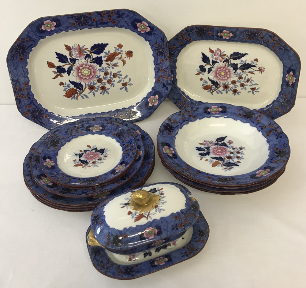 A quantity of early 19th Century Copeland Spode dinner ware of floral design with Royal Blue border