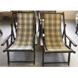 2 vintage wooden framed deckchairs. Both with checkered pattern fabric seats.