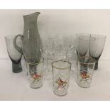 A vintage smoked glass water carafe & 5 matching glasses.