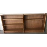 A pair of vintage teak bookcases each with 2 adjustable shelves.