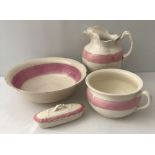 A late 19th/early 20th century 4 piece ceramic wash set in pink and cream.