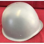 A Polish-made Wz75 steel helmet c.1988. Complete with helmet net .