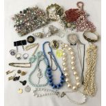 A collection of vintage costume jewellery and vintage beads.