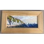 A modern framed oil on canvas of yachts off the coast of Normandy.