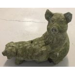 A pair of pigs concrete garden ornament.