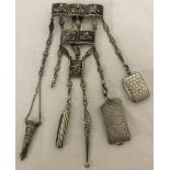 An antique silver and white metal 5 panel chatelaine depicting Hindu gods and their vahana's.