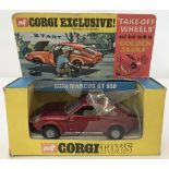 A 1968 Corgi "Take-Of-Wheels" and four built in "Golden Jacks" Mini Marcos GT850 in original box.