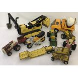 Nine vintage Tonka Toys. To include a cement mixer, scooter and a bulldozer.