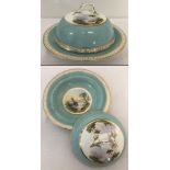 An Antique ceramic muffin dish with hand painted scenes to inside dish and lid.