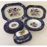 A quantity of early 19th Century Copeland Spode dinner ware of floral design with Royal Blue border
