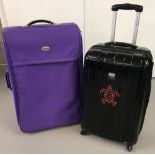 A France Bag solid suitcase on 4 wheels with retractable handle.