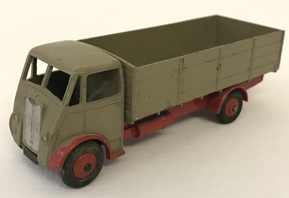 Dinky Supertoys Guy 4 ton lorry with fawn cab and truck and red chassis, wings 7 hubs.