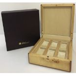 A boxed Walwood Bird's Eye maple watch box.