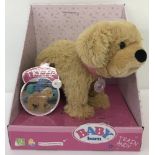 A brand new boxed Zapf Creations Baby Born Andy dog. Ex shop stock.