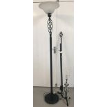 A matching modern black metal uplighter, table lamp and curtain rail with spiral detail.