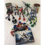 A box of 7 Lego Bionicle figures some with original boxes and instruction leaflets.