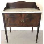 An Edwardian mahogany marble top washstand with single double door cupboard.