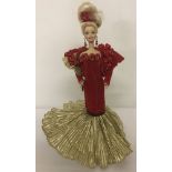 A 1995 Golden Anniversary porcelain Barbie doll.