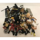 A box of assorted WCW, WWE & WWF wrestling figures and accessories.