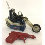 2 vintage toys. A Lone Star "Spudmatic" gun together with a 1971 Hasbro Scream 'N Demons motorcycle.