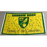 A Carrow Road "Home Of The Canaries" signed football flag with over 100 signatures.