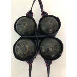 A set of 4 lawn bowls by Drakes Pride, size 5, with carrier.
