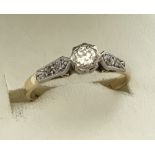 A ladies 18ct gold and platinum diamond solitaire ring.