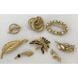 8 vintage gold tone brooches to include 1960's Grosse of Germany knotted brooch & stone set examples