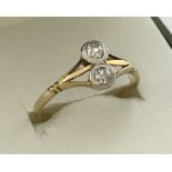 A ladies 18ct gold and platinum 2 diamond set dress ring.